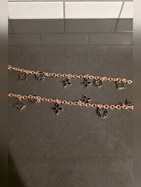Source Unknown Black and Gold Bah Charm